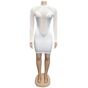 Close-up view of the sheer mesh long sleeve rhinestone bodycon dress texture and sparkle.