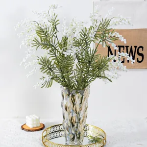 Beautiful artificial mimosa flowers bouquet with glass vase for elegant home decor.