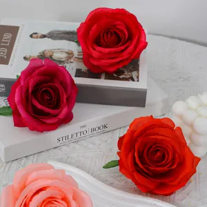 Artificial rose flower heads in multi colors, perfect for wedding decoration and floral crafts.