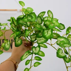Artificial hanging plant vine fake green leaves wall decoration for home living room indoor use.