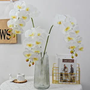 High-quality artificial phalaenopsis orchid floral arrangement with glass vase for home decor.