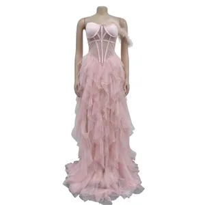 Pink strapless mesh long dress with corset bodice and feather shoulder detail for women.
