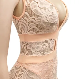 Detailed view of peach lace bodysuit featuring deep V-neck and hollow-out waist design.