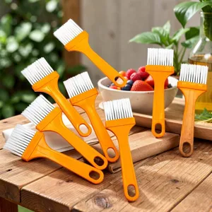 Plastic pastry brushes set with yellow handles and soft white bristles for baking, BBQ, and cooking.
