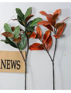 Ramo di foglie di magnolia artificiale finta pianta per composizione floreale foto