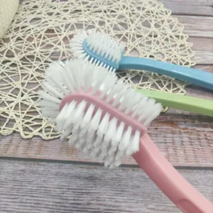 Multi-functional five-sided shoe brush detail, durable hard bristles and ergonomic long plastic handle.