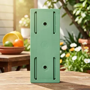 Green plastic power strip holder wall mount cable organizer socket fixator for home.
