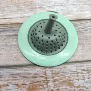 Detailed view of the kitchen sink strainer drain hair catcher with multi-hole dome filter.