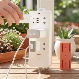 Punch-free power strip holder wall mounted socket fixer adhesive cable organizer bracket.