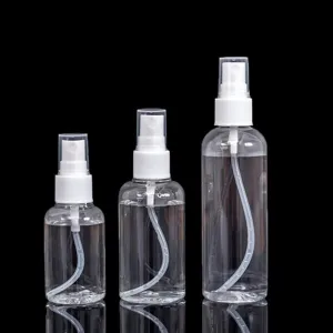 Clear plastic spray bottle set for travel liquid cosmetic dispensing fine mist pump.