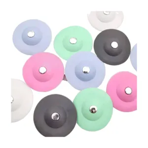 Multi-color silicone sink drain stopper and hair catcher for bathroom and kitchen sink use.