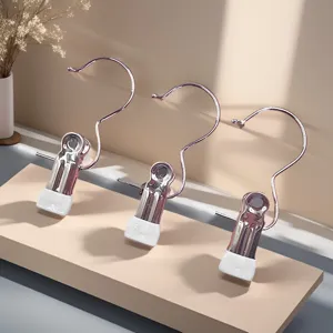 Stainless steel utility clip hooks with protective tips for drying clothes and hanging hats securely.