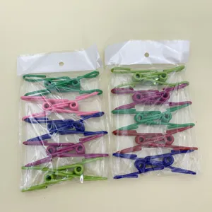 Detailed view of colorful stainless steel clothespins in transparent packaging bags for daily use.