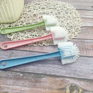 Multi-functional long-handled shoe brush with dense bristles for household laundry cleaning.