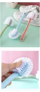 Detailed view of the multi-functional shoe cleaning brush showing soft bristle details.