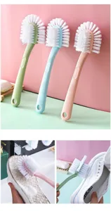 Multifunctional long handle shoe brush with stiff bristles for deep cleaning sneakers and clothes.