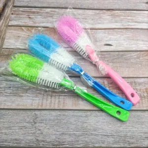 Long-handled cleaning brushes detail view, colorful plastic cup and pot brushes in packs.