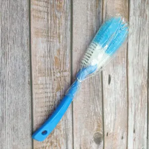 Long handle multi-functional cleaning brush for cups and pots with blue handle and bristles.