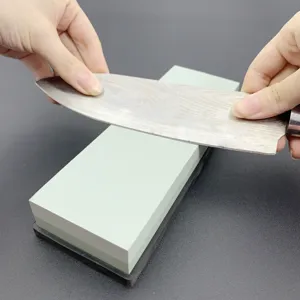Dual-sided whetstone sharpening stone set with non-slip base for kitchen knives use.