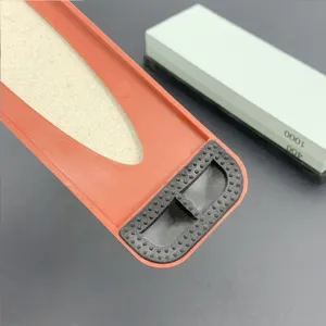 Dual grit whetstone sharpening stone set with non-slip base for kitchen knives use.