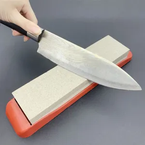 Dual-sided whetstone knife sharpener with anti-slip base for kitchen culinary tools.