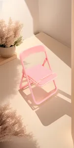 Pink mini folding chair phone holder detail view, cute desktop stand and cute table decor.