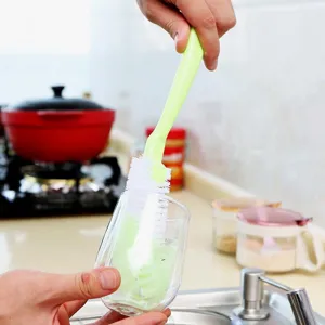Long handle cleaning brush for cups and pots, versatile kitchen tool with durable white bristles.