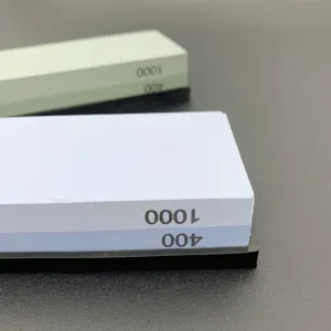 Close-up detail view of double sided whetstone with 400 and 1000 grit for knife sharpening.