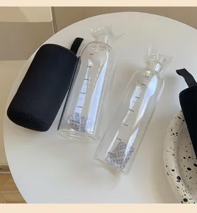 Clear flat glass water bottle with time markers and sleeve, minimalist daily drinking cup.