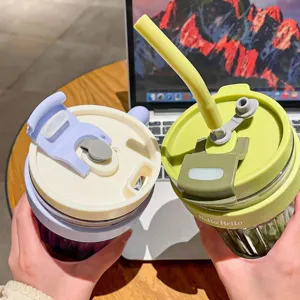 Dual-use straw water cup with handle and tea separator, stylish portable plastic mug.