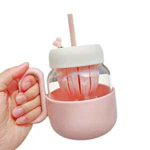 Pink glass water bottle with straw and handle, tea separator cup, cute office drinkware.