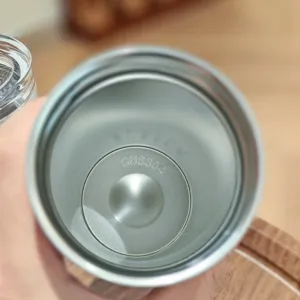 Stainless steel tumbler interior detail, high quality food grade 304 material close-up shot.