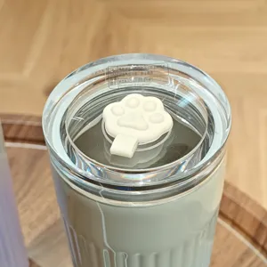 Stainless steel insulated coffee cup detail view, portable thermos water cup lid design with paw .
