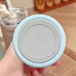 Stainless steel insulated cup bottom detail, showing clear text markings and clean surface.