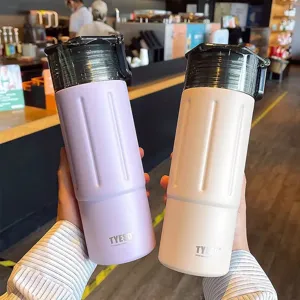 Tragbare Edelstahl Vakuum isolierte Wasserflasche mit Direkttrinkdeckel und Tragegriff.