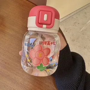 Cute floral straw water bottle detail, transparent fat belly cup with pink lid and sweet design.