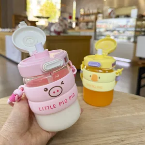 Cute cartoon straw water bottle detail, portable glass cup with strap for students and gifts.