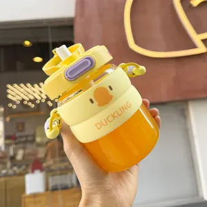 Close-up detail of the cute yellow duck straw water bottle with silicone protective sleeve.