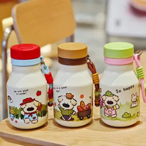 Cute stainless steel water bottle detail showing cartoon dog prints, portable design.