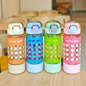 Portable student straw water bottle with dual-drink design and stylish checkerboard pattern.
