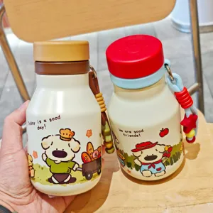 Portable stainless steel vacuum insulated water bottle with cute cartoon dog design and lanyard.