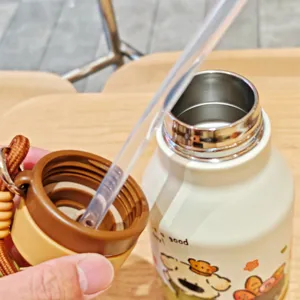 Stainless steel vacuum insulated water tumbler with cute cartoon print and straw detail.