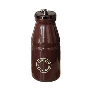Portable retro milk bottle stainless steel thermos cup, compact design with carrying handle.