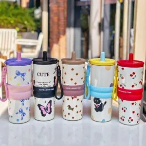 Stainless steel insulated tumbler set with straw and silicone sleeve, cute print design.
