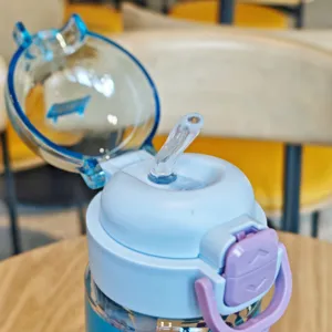 Close-up detail of a blue portable plastic straw water bottle with secure lock cap.