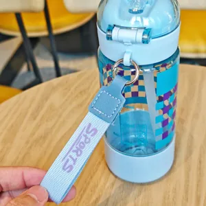Portable plastic straw water bottle detail view, student sports cup with convenient strap.