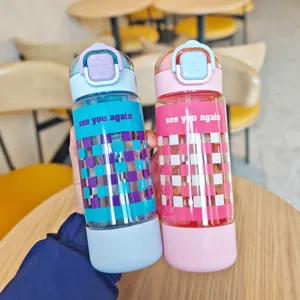 Portable plastic water bottle with straw and cute checkered design for students and sports.