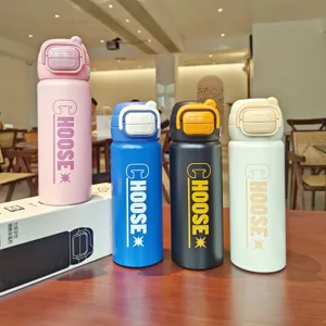 Close-up of colorful stainless steel dual-drink thermos water bottles with bounce lids.