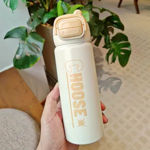 Stainless steel thermal water bottle with dual-drink lid and handle for daily portable hydration.