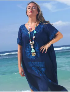 Boho beach long beaded necklace detail view, handmade colorful tassel and shell pendant.